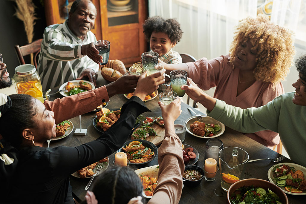 family eating holiday dinner healthy eating habits for the holidays