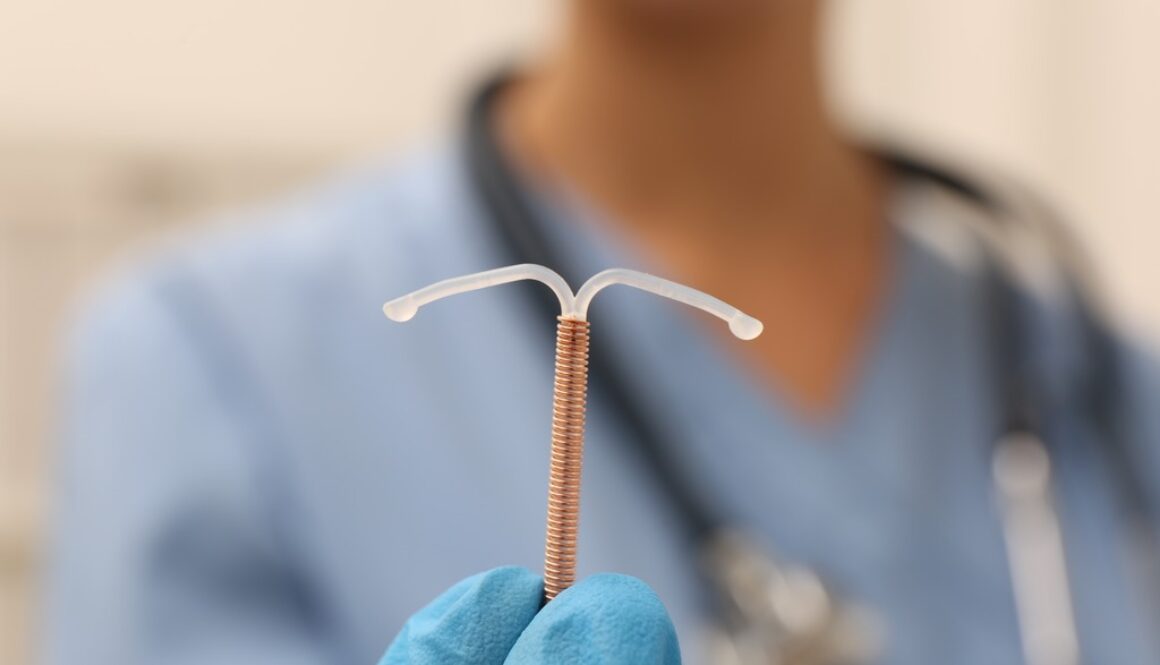 Doctor Holding an IUD Insertion