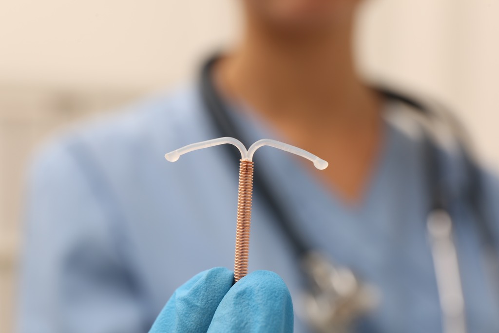 Doctor Holding an IUD Insertion