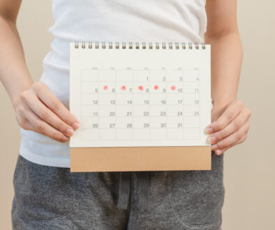 Woman Holds a Calendar and Wonders Why Is My Period Late