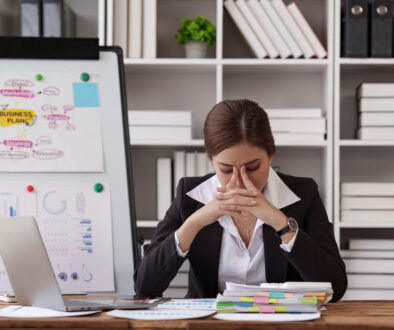 An Overwhelmed Businesswoman Demonstrates Connections Between Stress and Gynecological Problems