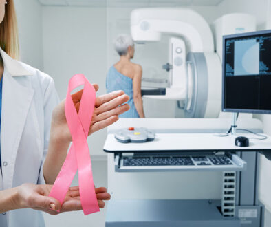 A Woman With a Breast Cancer Ribbon Answers When to Get a Mammogram