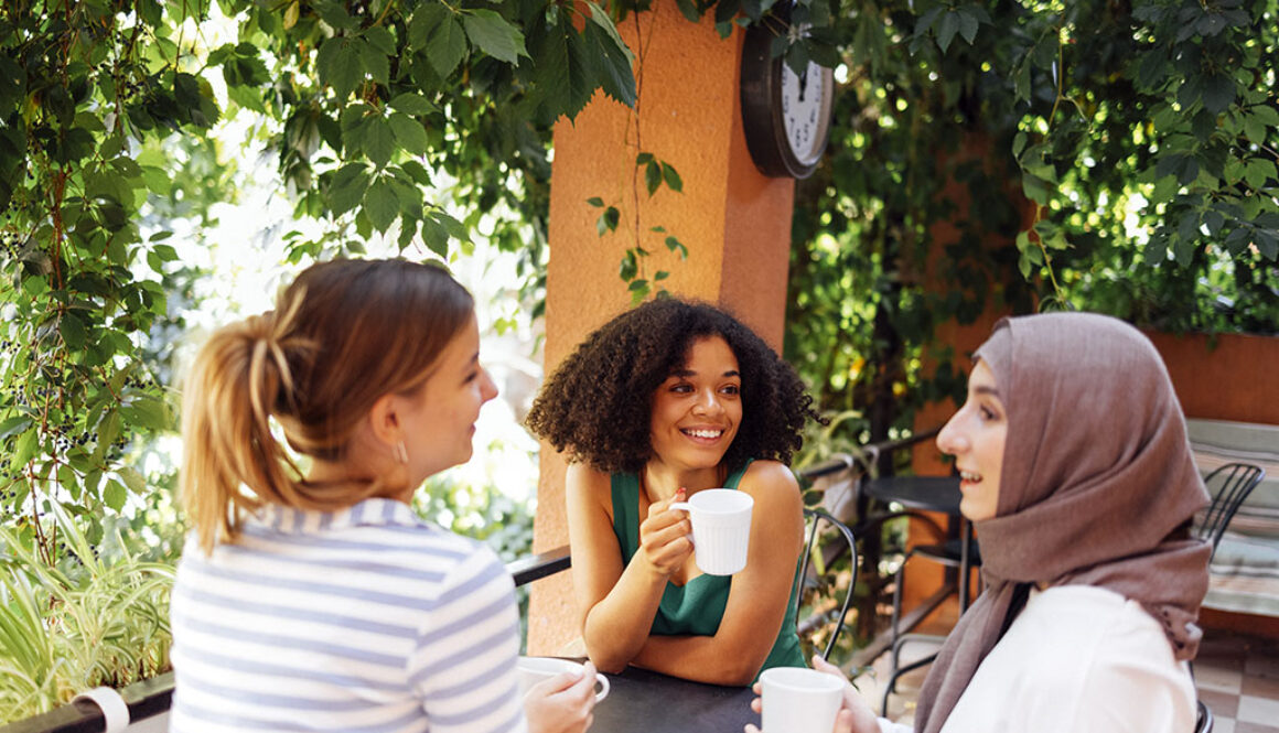 A Group Of Girls Sitting At A Table Drinking Coffee & Talking About Sonohysterogram.
