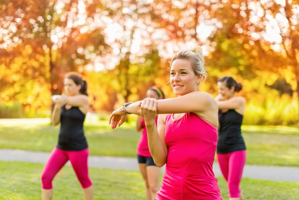 A Group of Four Women Stretching Before an Outdoor Jog How to Improve Heart Health