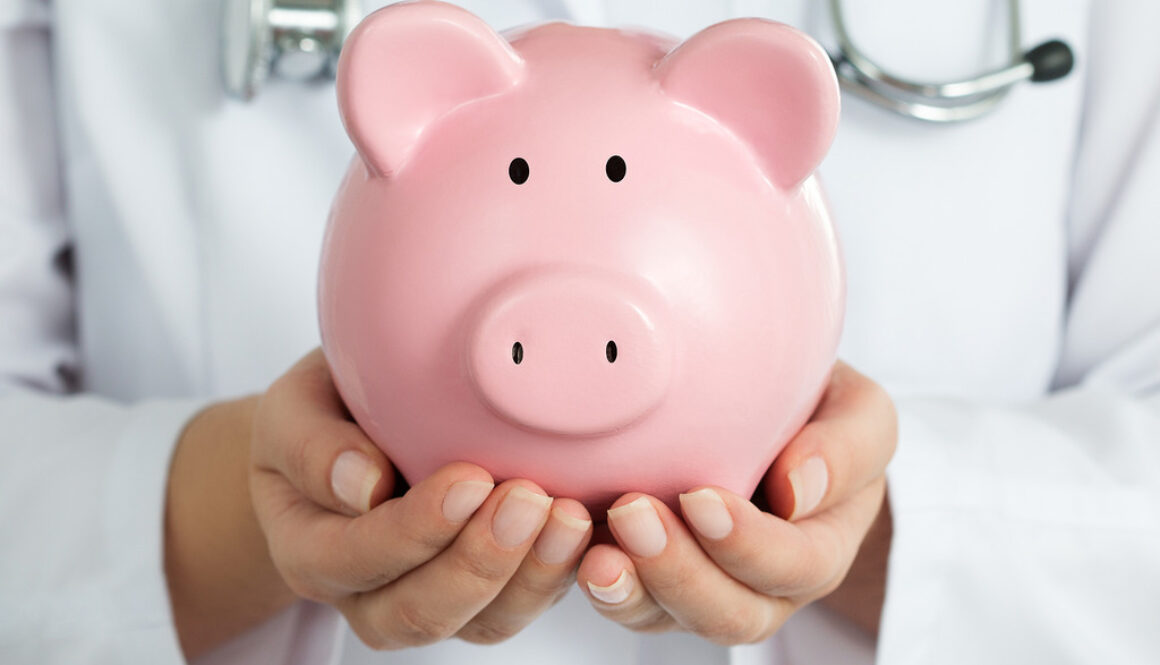 Closeup of a Female Women’s Health Doctor Holding a Piggy Bank In-Office Procedures